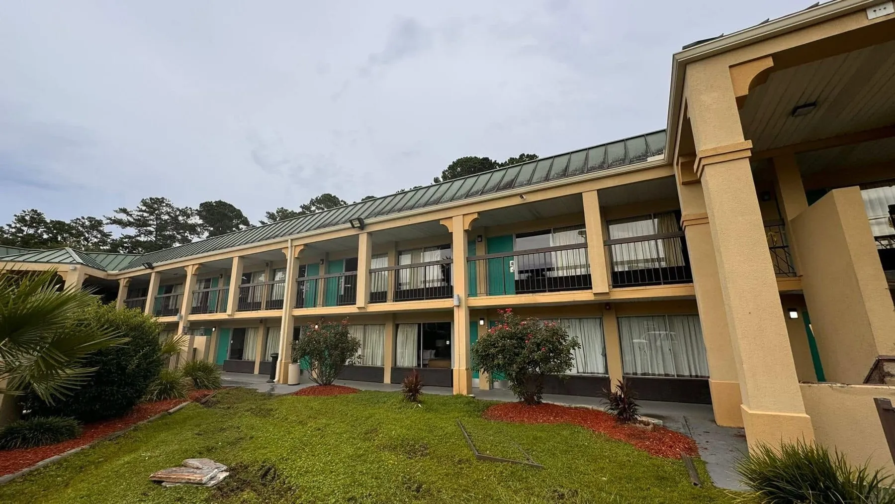 Two-story commercial building with gutters along both rooflines